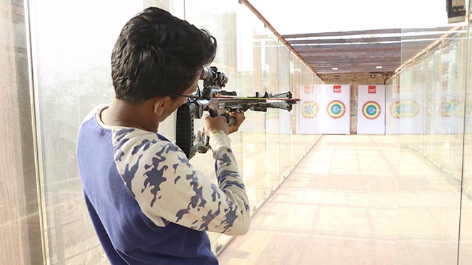 Test your shooting skills with Pistol Bow activity at Della